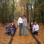 Family portraits on train tracks in Fall